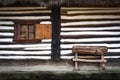 Rudimentary type of wheat mill in front of a Romanian house Royalty Free Stock Photo